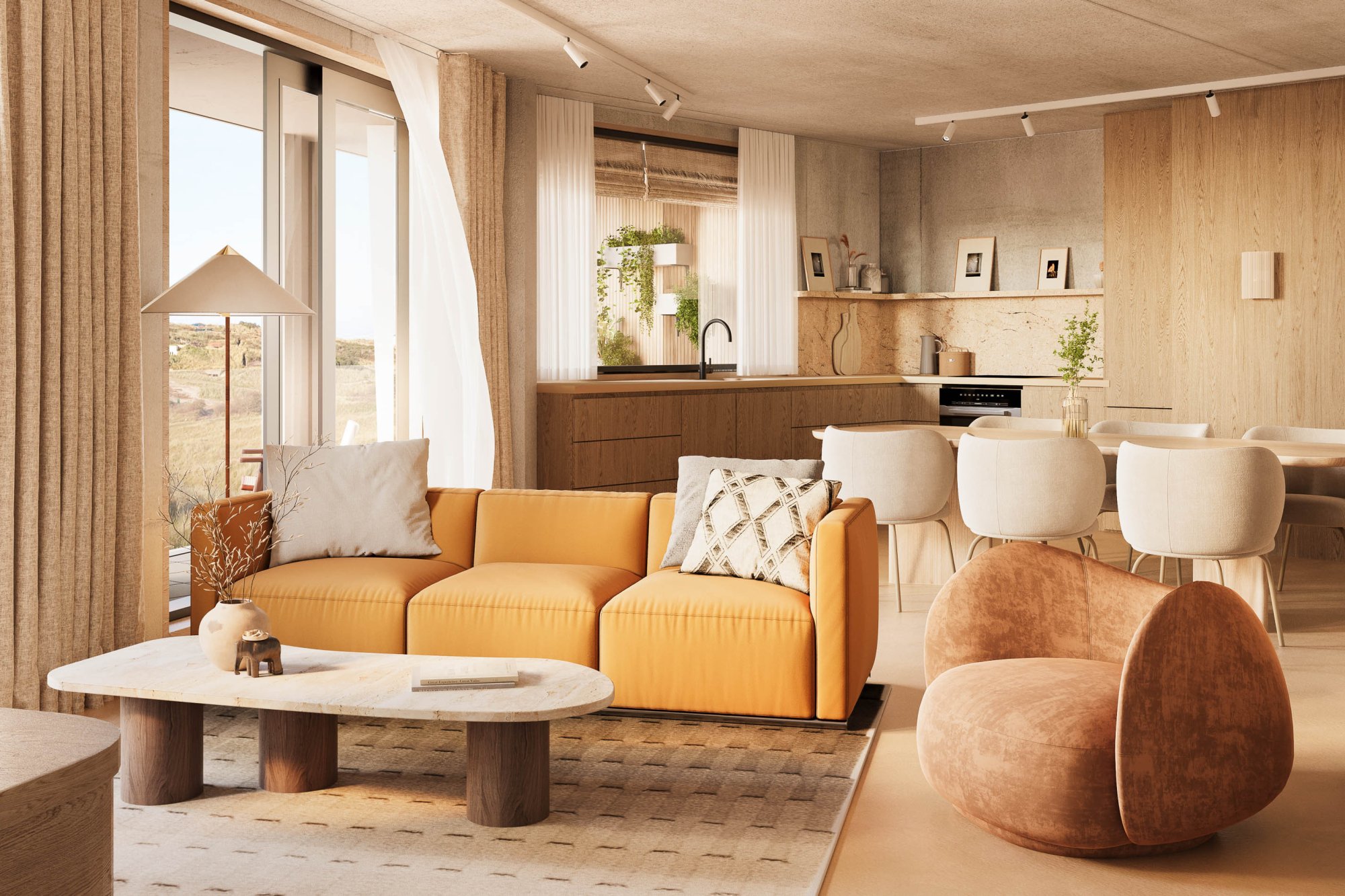 Stijlvol ingericht appartement met open keuken, ronde eettafel en zithoek met oranje bank en designstoel, uitzicht op de duinen.